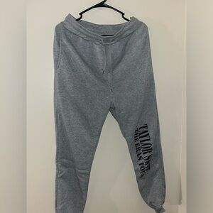 grey Eras tour sweatpants.